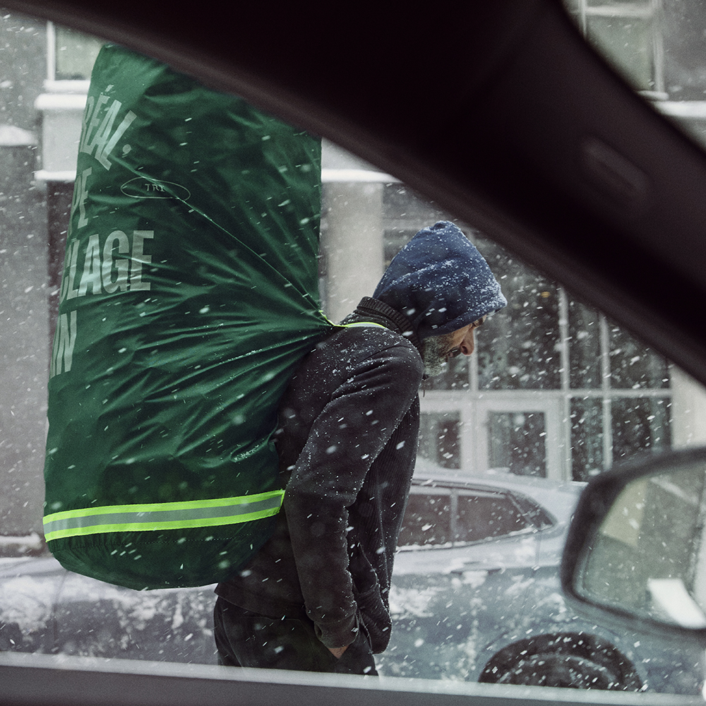 Binner carrying Dignity Bag in snow